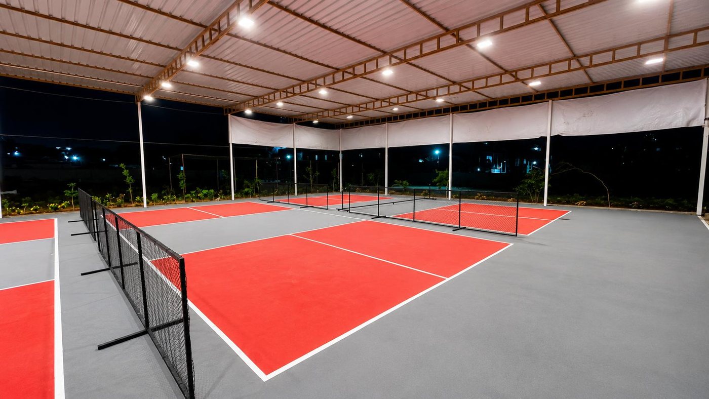 Floodlit covered pickleball courts at Lakeside Pickle Club
